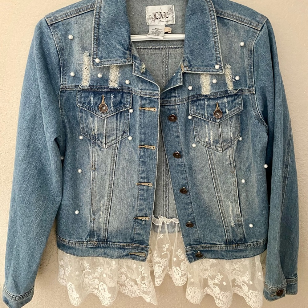 Jeans Jacket size L. It fits size 8 very tight.